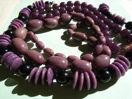 Several Purple and Black Bakelite Bead Necklaces